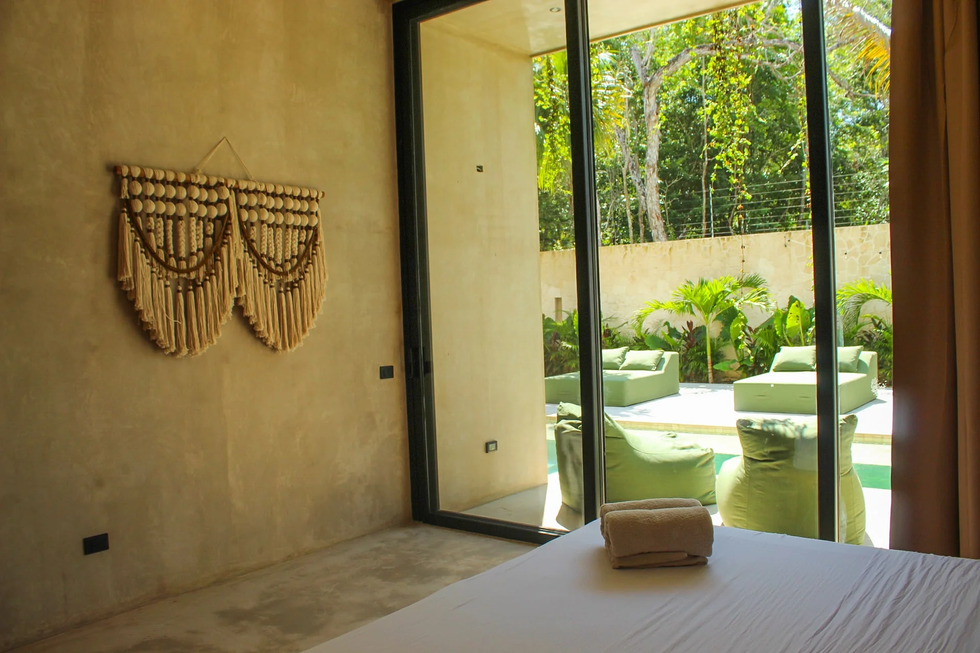 Casa Uulum bedroom opening onto the pool terrace